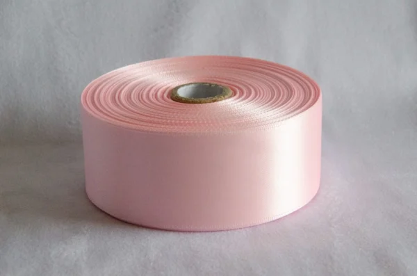 50 Yard roll of 1.5" Single Faced satin Ribbon in light pink color.